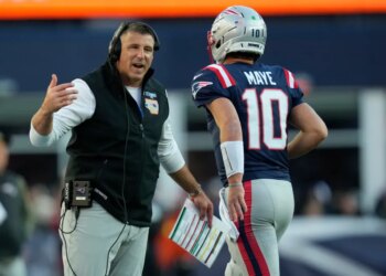 Patriots coach Mike Vrabel with quarterback Drake Maye during the team's Week 9 win over the Falcons.