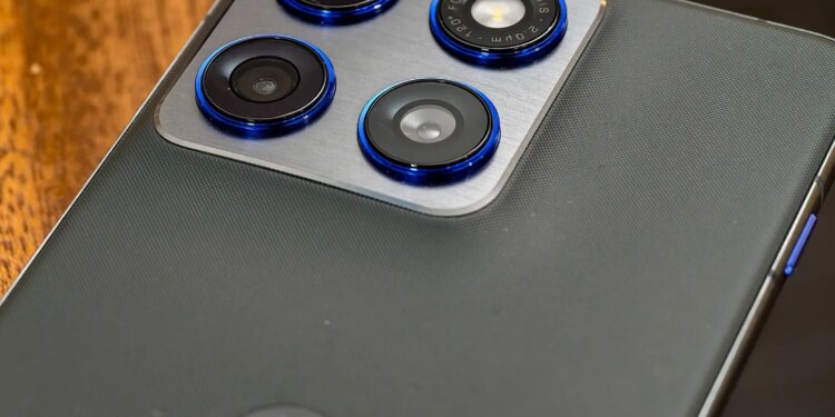 Photo of Motorola Edge 70 lying on a wooden table showing the cameras