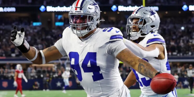 Marshawn Kneeland celebrating with Malik Davis after recovering a blocked punt for a touchdown.
