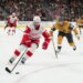 Detroit Red Wings center Dylan Larkin (71) skates with the puck against Vegas Golden Knights center Brett Howden (21) during a hockey game.