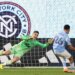 Charlotte FC goalkeeper Kristijan Kahlina (1) dives to save a shot by New York City forward Agustín Ojeda (26) during a shootout during Game 2 in the first round of MLS soccer's Eastern Conference playoffs Saturday, Nov. 1, 2025.