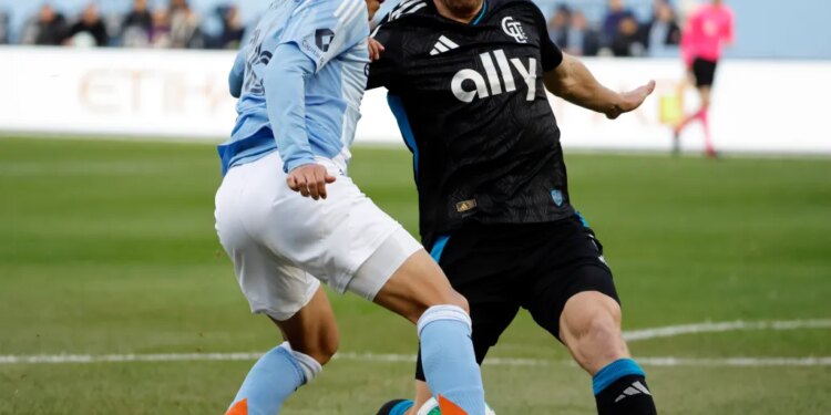 New York City forward Alonso Martínez, left, and Charlotte FC defender Tim Ream compete for the ball during the first half of Game 2 in the first round of MLS soccer's Eastern Conference playoffs, Saturday, Nov. 1, 2025
