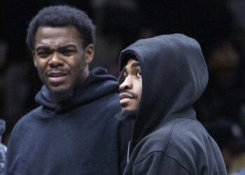 Day'Ron Sharpe (left) and Cam Thomas, who did not play because of injuries, look on during the Nets' 119-109 loss to the Raptors on Nov. 11, 2025.