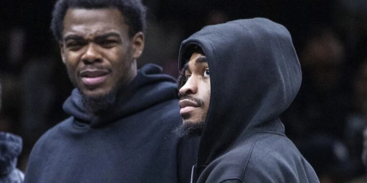 Day'Ron Sharpe (left) and Cam Thomas, who did not play because of injuries, look on during the Nets' 119-109 loss to the Raptors on Nov. 11, 2025.