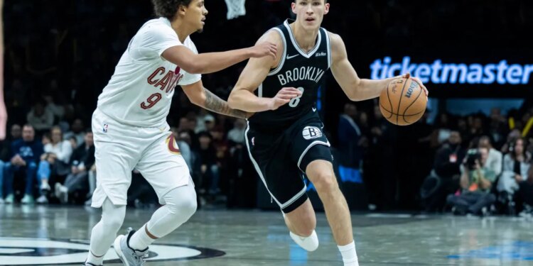 Brooklyn Nets guard Egor Demin (8) drives around Cleveland Cavaliers guard Craig Porter Jr. (9) in the second half at Barclays Center, Friday, Oct. 24, 2025, in Brooklyn, NY.