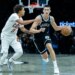 Brooklyn Nets guard Egor Demin (8) drives around Cleveland Cavaliers guard Craig Porter Jr. (9) in the second half at Barclays Center, Friday, Oct. 24, 2025, in Brooklyn, NY.