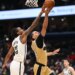 Brooklyn Nets center Nic Claxton (33) blocks a shot by Washington Wizards forward Kyshawn George (18).
