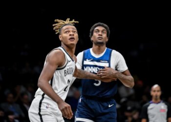 Brooklyn Nets forward Noah Clowney (21) boxes out against Minnesota Timberwolves forward Jaden McDaniels (3) during the first half at Barclays Center.