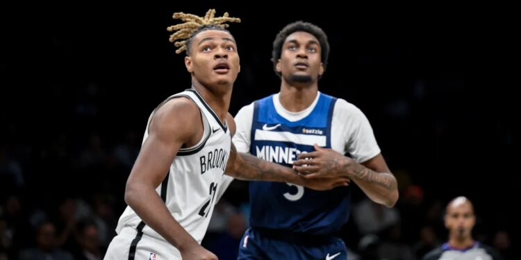 Brooklyn Nets forward Noah Clowney (21) boxes out against Minnesota Timberwolves forward Jaden McDaniels (3) during the first half at Barclays Center.