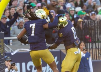 Notre Dame Fighting Irish safety Jalen Stroman (7) celebrates scoring on an interception with Notre Dame Fighting Irish safety Adon Shuler (8) against the Syracuse Orange during the first half at Notre Dame Stadium