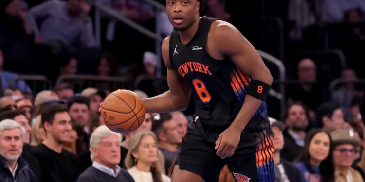 New York Knicks forward OG Anunoby (8) dribbles the ball against the Miami Heat.