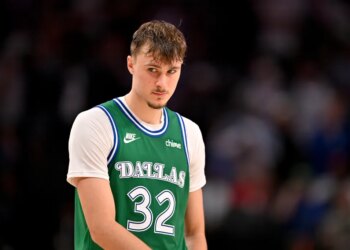 Dallas Mavericks player wearing a green number 32 jersey.