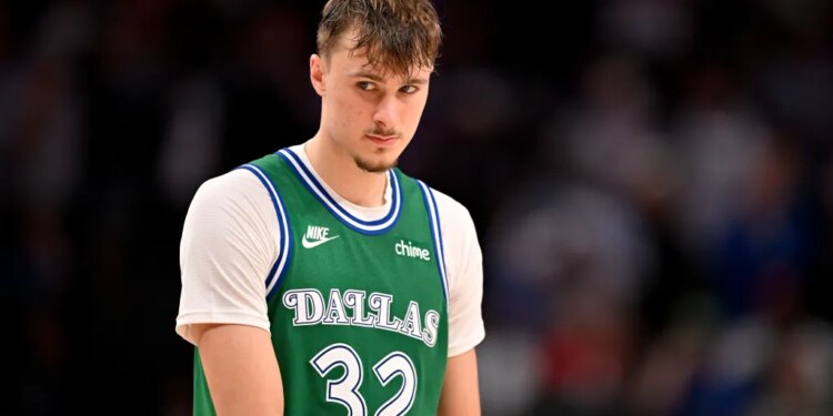 Dallas Mavericks player wearing a green number 32 jersey.
