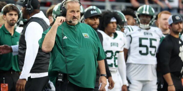 Ohio Bobcats head coach Brian Smith on the sideline during a football game.