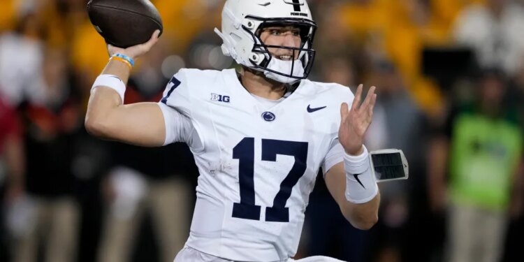 Penn State quarterback Ethan Grunkemeyer throwing a pass during a college football game against Iowa.