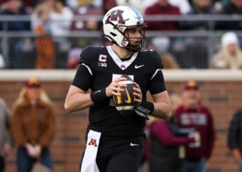 Minnesota Golden Gophers quarterback Drake Lindsey (5) looks to throw against the Michigan State Spartans.