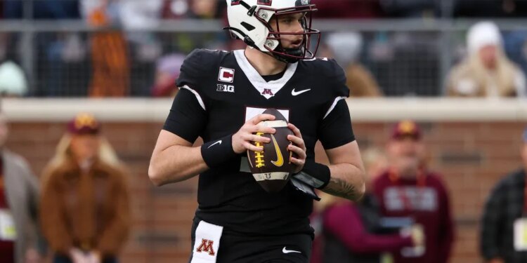 Minnesota Golden Gophers quarterback Drake Lindsey (5) looks to throw against the Michigan State Spartans.