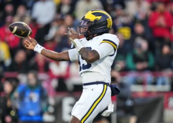 Michigan quarterback Bryce Underwood (19) throws against Maryland during the first half of an NCAA college football game, Saturday, Nov. 22, 2025, in College Park, Md. (AP Photo/Stephanie Scarbrough)