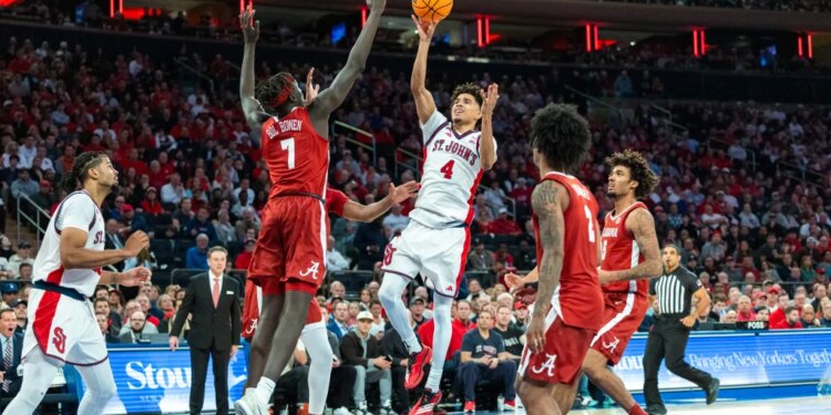 Oziyah Sellers of St. John's Red Storm shoots a basketball over Taylor Bol Bowen of Alabama Crimson Tide.
