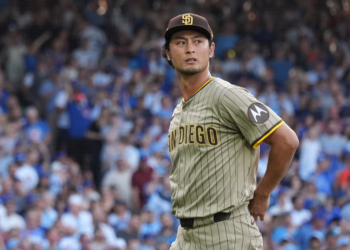San Diego Padres player Darvish Yu wearing a pinstriped uniform and cap during a game.