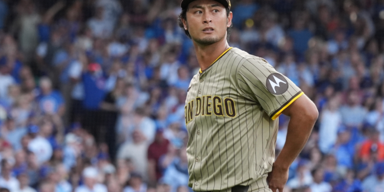 San Diego Padres player Darvish Yu wearing a pinstriped uniform and cap during a game.