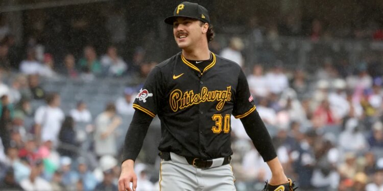 Pittsburgh Pirates pitcher Paul Skenes smiling on the mound.