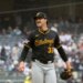 Pittsburgh Pirates pitcher Paul Skenes smiling on the mound.