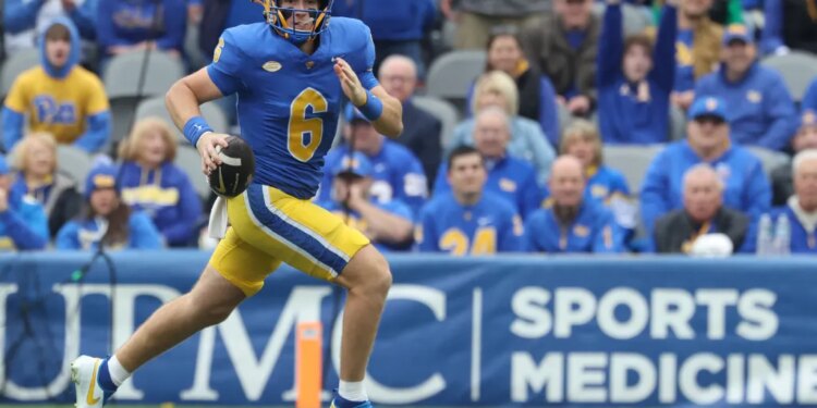 Pittsburgh Panthers quarterback Mason Heintschel (6) runs the ball against the Notre Dame Fighting Irish.