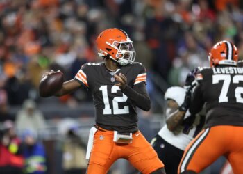 Ceveland Browns quarterback Shedeur Sanders (12) drops back to pass during the third quarter against the Baltimore Ravens at Huntington Bank Field.