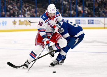 Artemi Panarin battles Jake Guentzel for the puck during the Rangers' 7-3 blowout road win over the Lightning on Nov. 12, 2025.