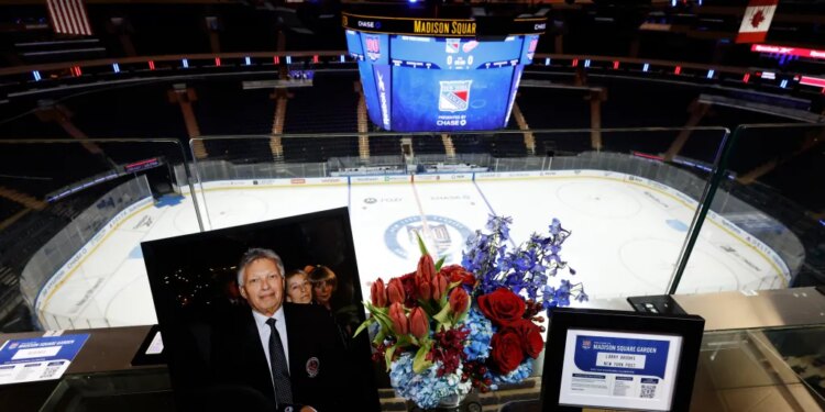 A portrait of Hall of Fame Hockey writer Larry Brooks sits in his desk spot in the press box before the Rangers' game against the Red Wings on Nov. 16, 2025.