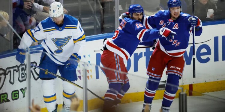 The Rangers celebrate a goal during their Nov. 24 win against the Blues.