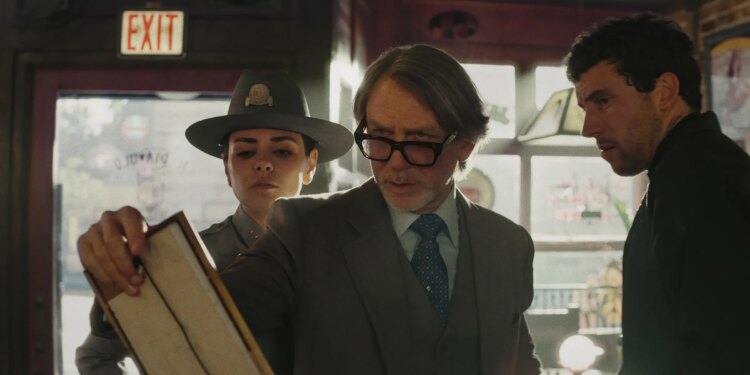 A still photo of Mila Kunis, Daniel Craig, and Josh O’Connor in the film Wake Up Dead Man.