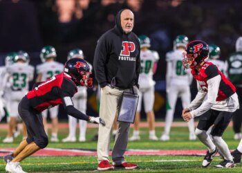 Plainedge head coach Rob Shaver with Wide Receiver/Defensive Back Fabrizio Orepeza (left) and Wide Receiver/Defensive Back James Cito (right).