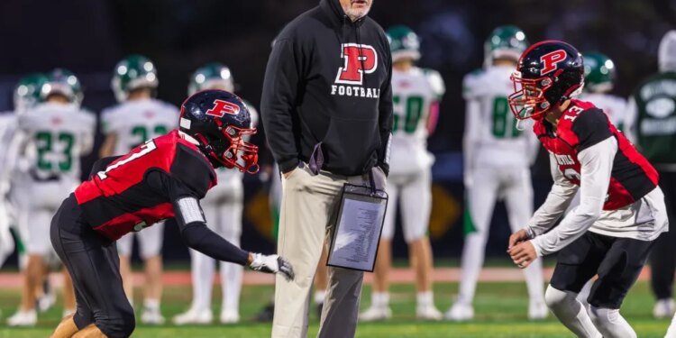 Plainedge head coach Rob Shaver with Wide Receiver/Defensive Back Fabrizio Orepeza (left) and Wide Receiver/Defensive Back James Cito (right).