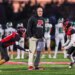 Plainedge head coach Rob Shaver with Wide Receiver/Defensive Back Fabrizio Orepeza (left) and Wide Receiver/Defensive Back James Cito (right).