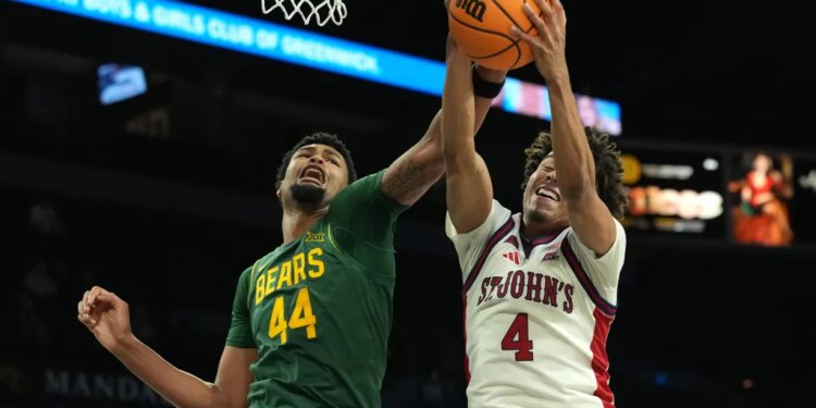 Oziyah Sellers, who scored 22 points and hit five 3-pointers, battles for a rebound with Caden Powell (left) during St. John's 96-81 win over Baylor on Nov. 25, 2025.
