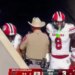 The Texas trooper stepping between two South Carolina players after scoring a touchdown.
