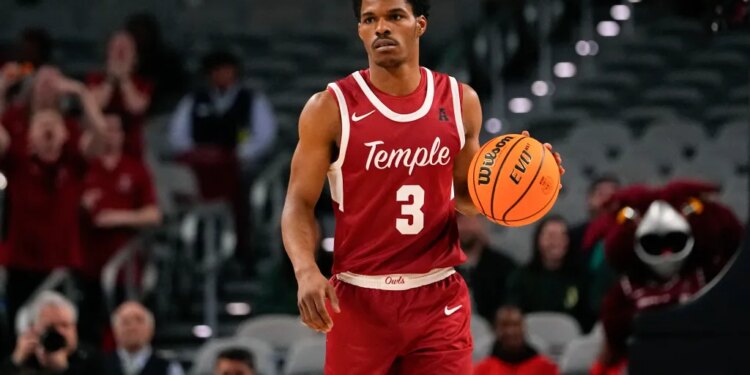 Temple's Hysier Miller dribbles the basketball during a game.