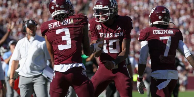 Texas A&M Aggies quarterback Marcel Reed (10) celebrates with wide receiver Ashton Bethel-Roman (3) after a touchdown during the third quarter against the South Carolina Gamecocks at Kyle Field.