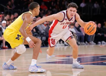 St. John's Red Storm guard Dylan Darling (0) drives around the outside during the first half when the St. John's Red Storm played the Michigan Wolverines Saturday, October 25, 2025 at Madison Square Garden in Manhattan, NY.