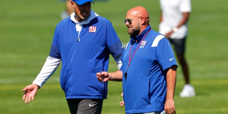 New York Giants offensive coordinator Mike Kafka and head coach Brian Daboll at football practice.