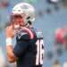 New England Patriots quarterback Tommy DeVito (16) practices before the game against the Las Vegas Raiders.