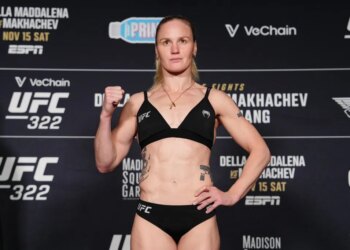 A female fighter posing at the UFC 322 weigh-in.