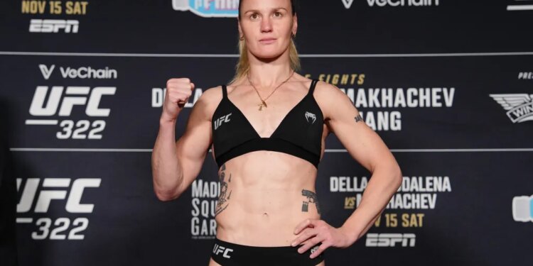 A female fighter posing at the UFC 322 weigh-in.