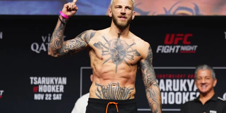Dan Hooker poses at a UFC Fight Night weigh-in.