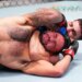 Dulgarian v del Valle in a UFC fight, with del Valle applying a chokehold to Dulgarian.
