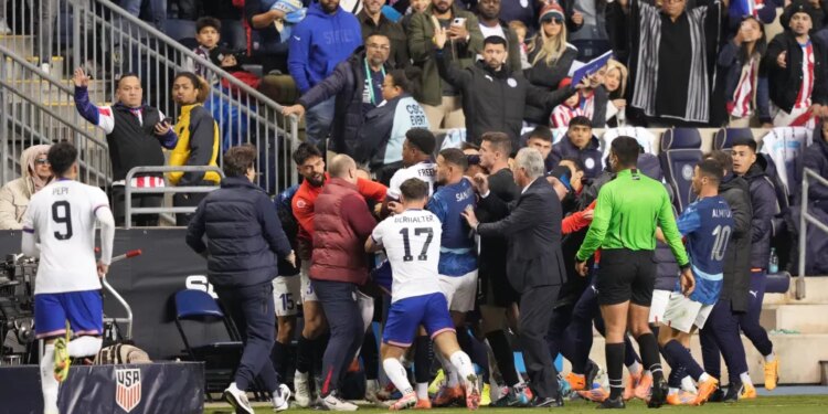 A fight breaking out between the United States and Paraguay soccer teams during a game.