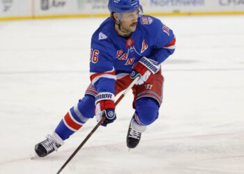New York Rangers center Vincent Trocheck (16) moves the puck down ice.