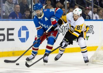 Rangers center Vincent Trocheck (16) is defended by the Penguins' Ben Kindel on Oct. 7, 2025.
